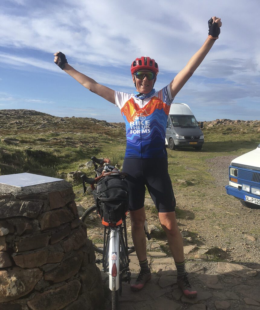 Linda celebrating at the summit of Bealach na Ba on the penultimate day of North Coast 500