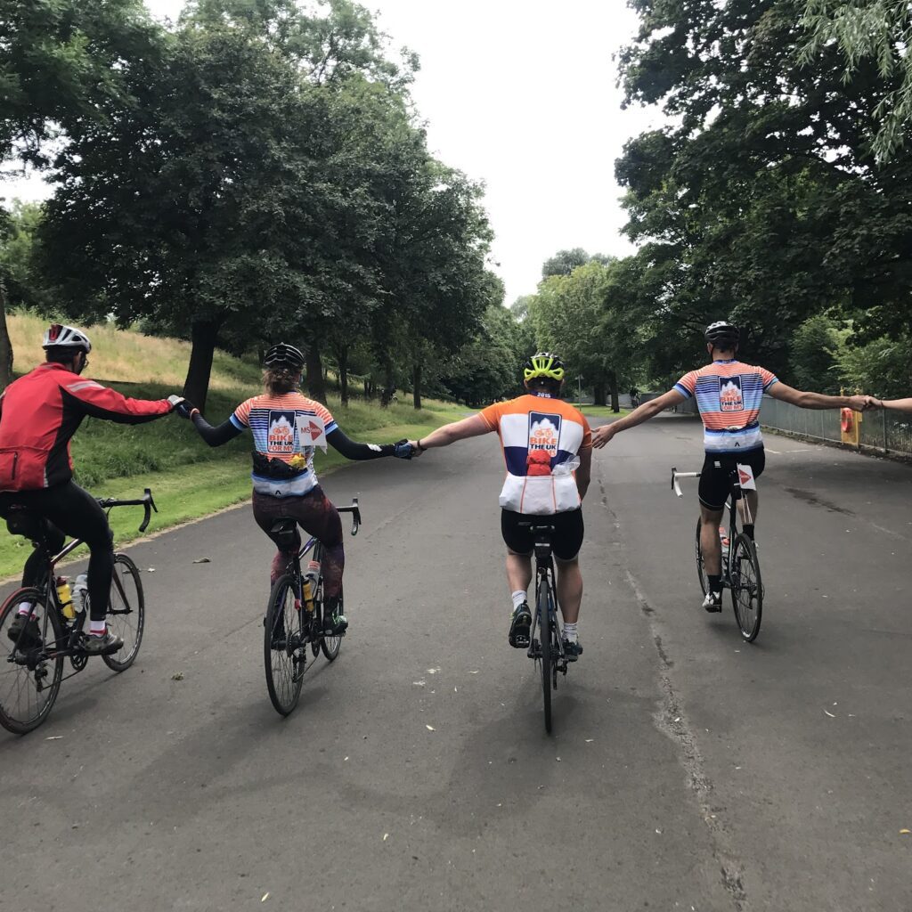 Bik the UK cyclist holding hands