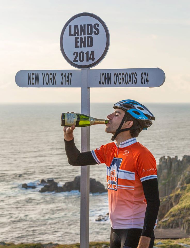 Celebrating in Land's End having completed JOGLE.